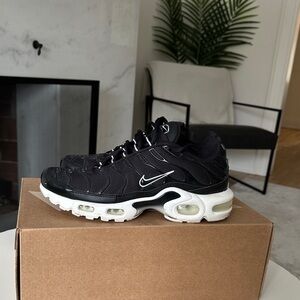 Nike Black and White Women’s Air Max Plus Sneakers